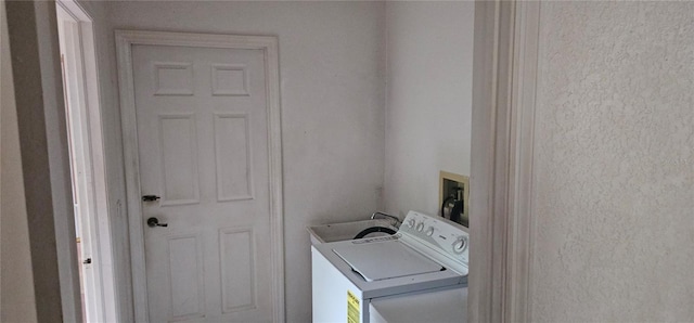 laundry area with washing machine and dryer and sink