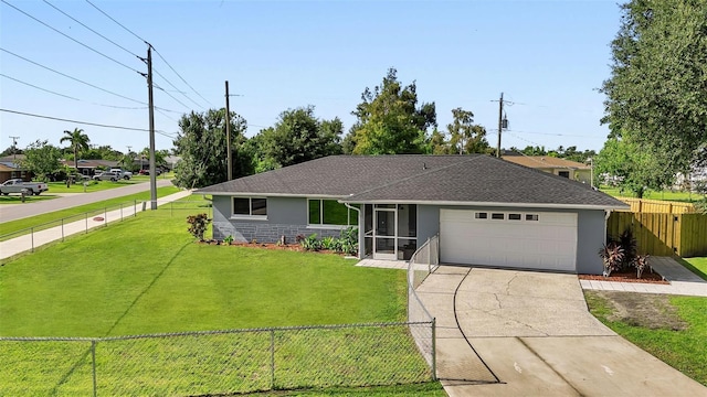 single story home featuring a sunroom, a front lawn, and a garage