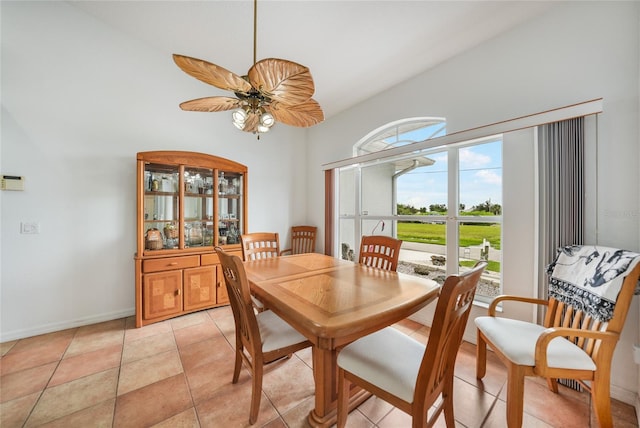 dining room with ceiling fan and light tile patterned flooring