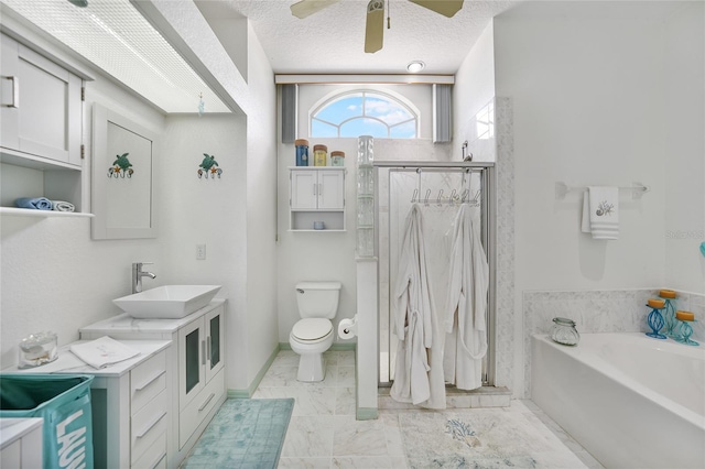 full bathroom with plus walk in shower, a textured ceiling, toilet, ceiling fan, and vanity