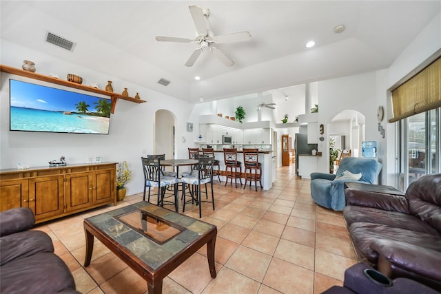 living room featuring ceiling fan and light tile patterned floors