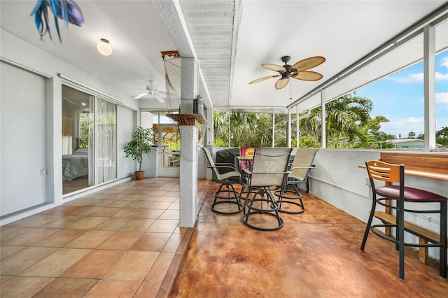 sunroom / solarium with ceiling fan