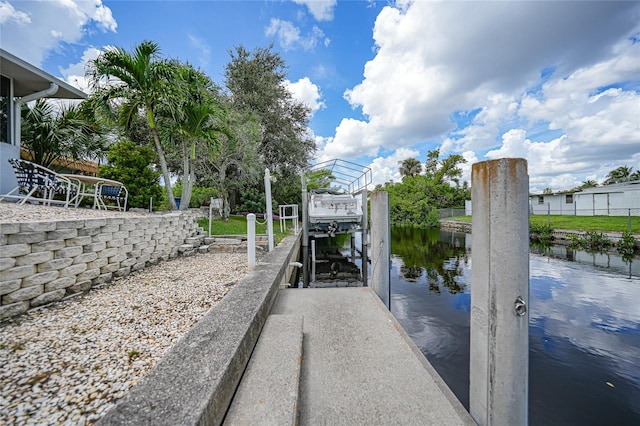 dock area with a water view