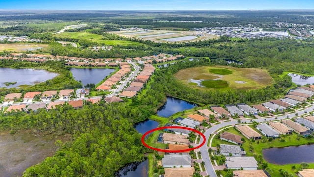 bird's eye view featuring a water view and a residential view