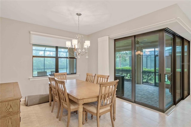 dining room featuring light tile patterned floors and a notable chandelier