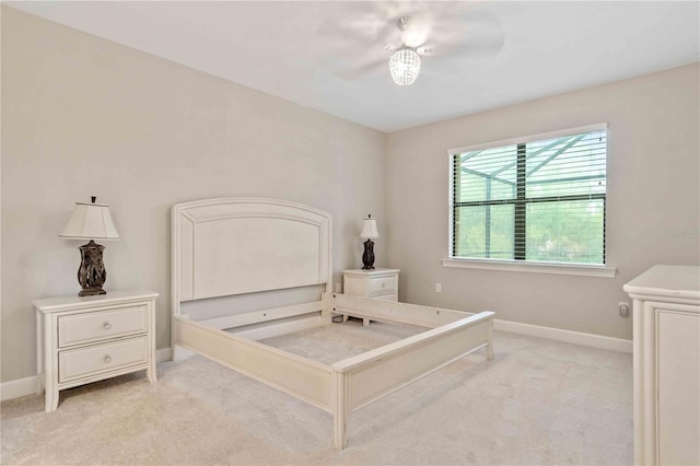 bedroom with a ceiling fan, carpet, and baseboards