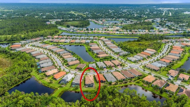 bird's eye view with a residential view and a water view