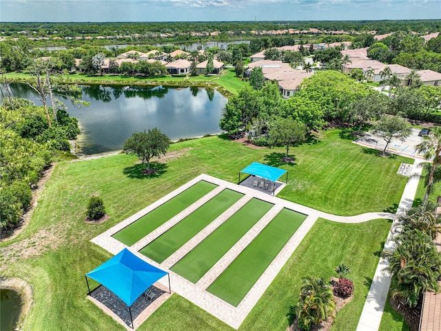 drone / aerial view with a water view and a residential view