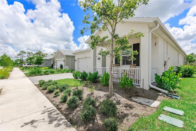 view of front of home featuring a garage and covered porch