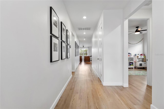 hall with light hardwood / wood-style floors