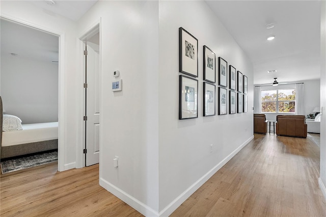 hallway with light wood-type flooring