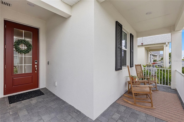 entrance to property with a porch