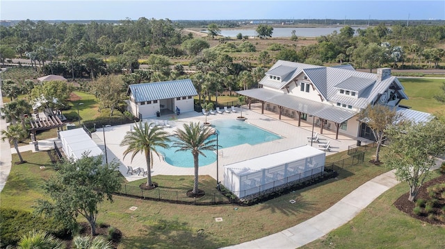 view of pool with a yard and a patio