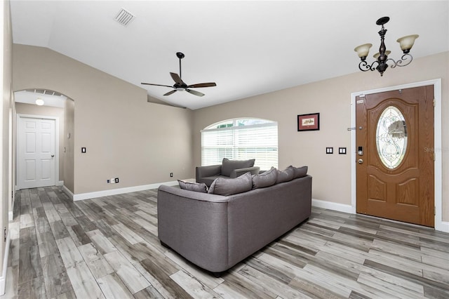 3159 Draper Ter, North Port, FL 34286 - living area featuring vaulted ceiling, a ceiling fan, light wood finished floors, baseboards, and a chandelier