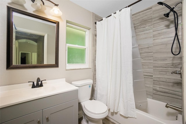 full bathroom featuring toilet, shower / tub combo, and vanity