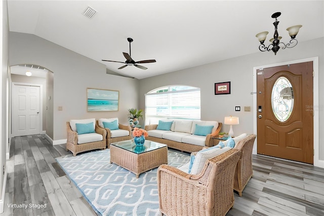 3159 Draper Ter, North Port, FL 34286 - living area with vaulted ceiling, ceiling fan, healthy amount of natural light, light wood-style floors, and a chandelier