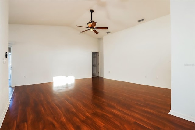 empty room featuring ceiling fan, hardwood / wood-style flooring, and vaulted ceiling