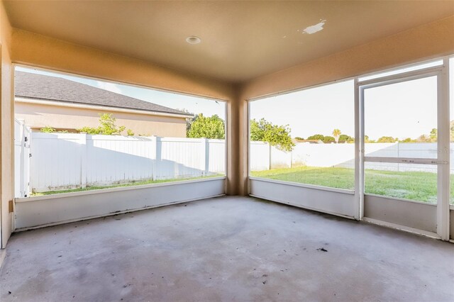 unfurnished sunroom with plenty of natural light