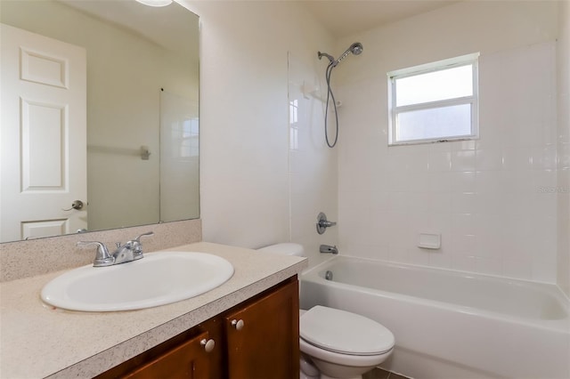 full bathroom featuring vanity, toilet, and tiled shower / bath combo