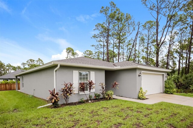 ranch-style house with a front lawn and a garage