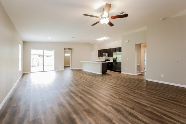 unfurnished living room featuring ceiling fan, wood-type flooring, and vaulted ceiling