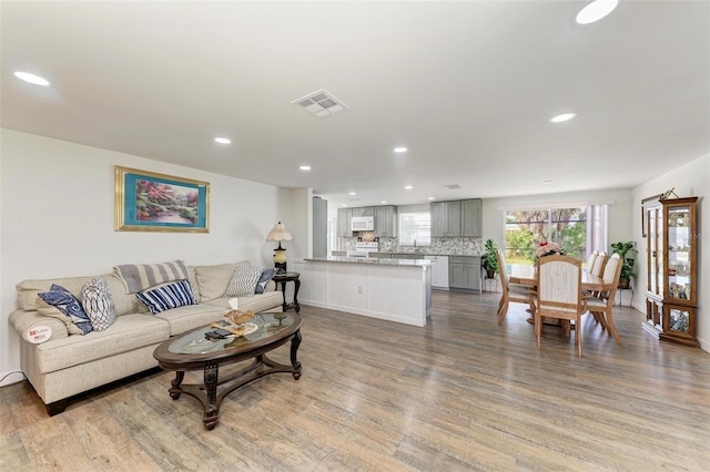 living room with light hardwood / wood-style floors