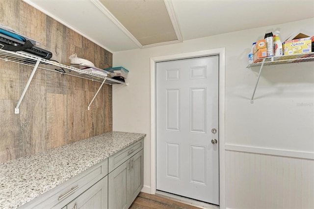 washroom featuring hardwood / wood-style flooring and wood walls