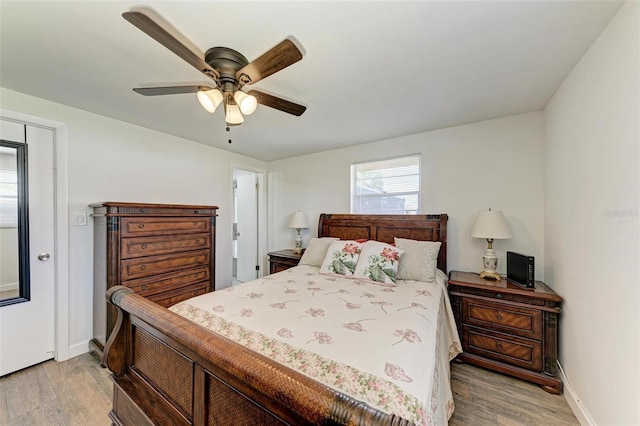 bedroom featuring light wood-type flooring and ceiling fan