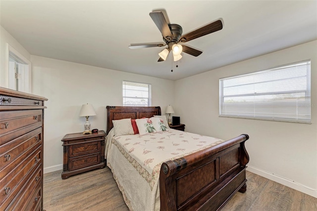 bedroom with hardwood / wood-style flooring and ceiling fan