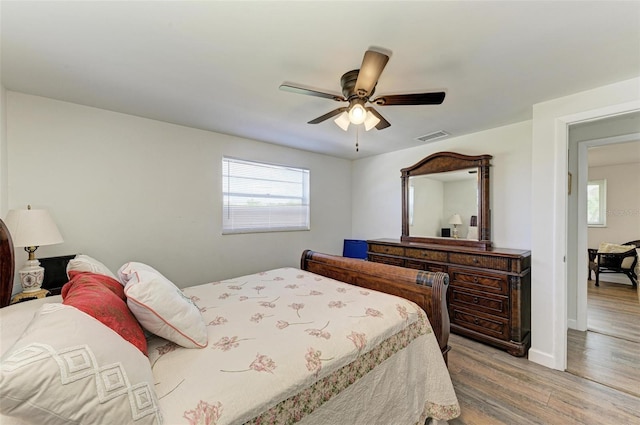 bedroom featuring light wood-type flooring and ceiling fan