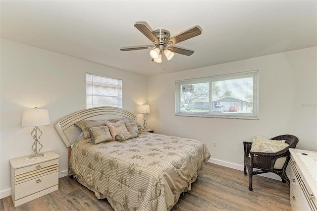 bedroom with hardwood / wood-style floors and ceiling fan