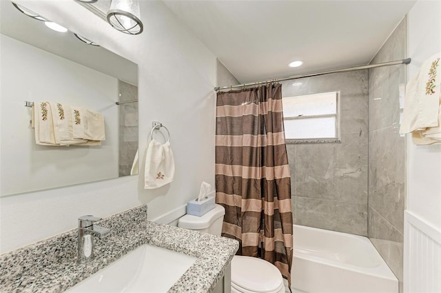 full bathroom featuring vanity, toilet, and shower / bathtub combination with curtain