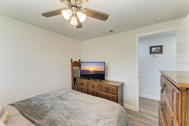 bedroom featuring light hardwood / wood-style flooring and ceiling fan