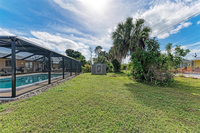 view of yard featuring glass enclosure and a storage shed