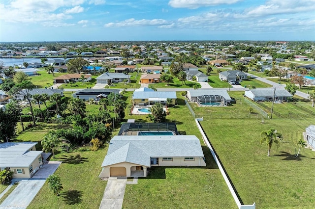 birds eye view of property with a residential view