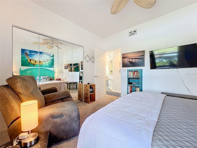 bedroom featuring a closet, ceiling fan, and carpet