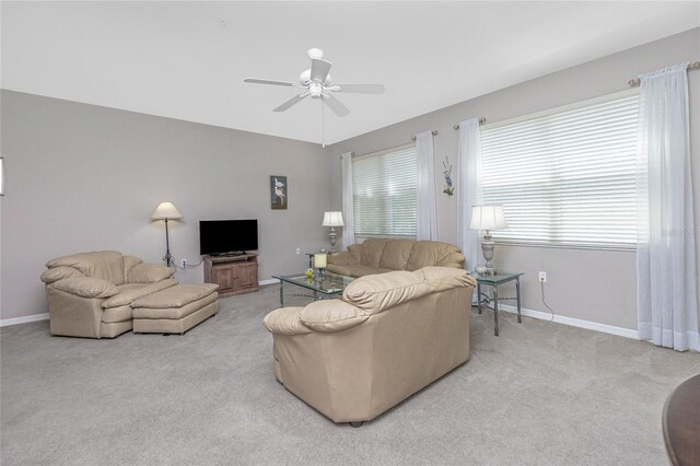 living room featuring ceiling fan and light carpet