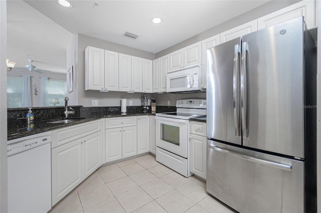 kitchen with white cabinets, white appliances, sink, and ceiling fan