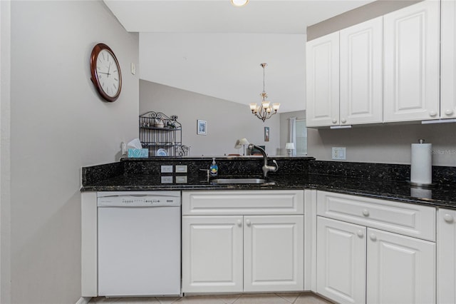 kitchen with dark stone countertops, a notable chandelier, white dishwasher, sink, and white cabinets