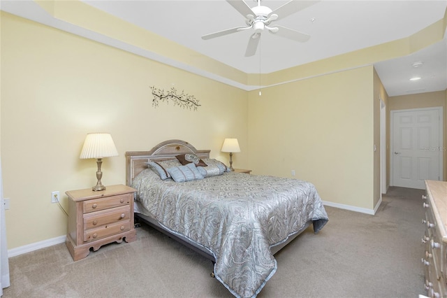 bedroom featuring light colored carpet and ceiling fan