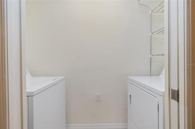 laundry area with washer and clothes dryer