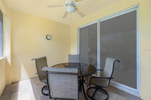 view of patio featuring ceiling fan and outdoor dining space