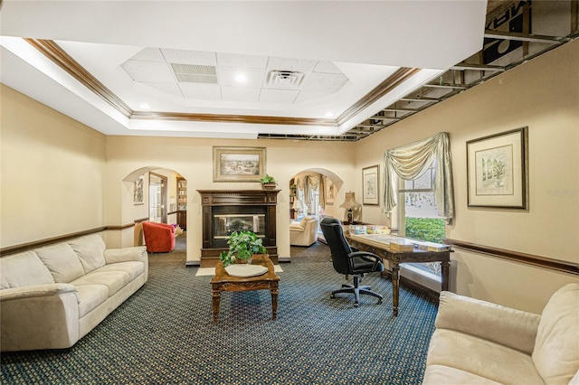 office featuring ornamental molding, a raised ceiling, and carpet floors