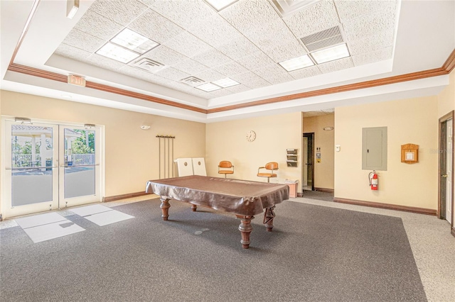 rec room featuring pool table, french doors, a tray ceiling, ornamental molding, and electric panel