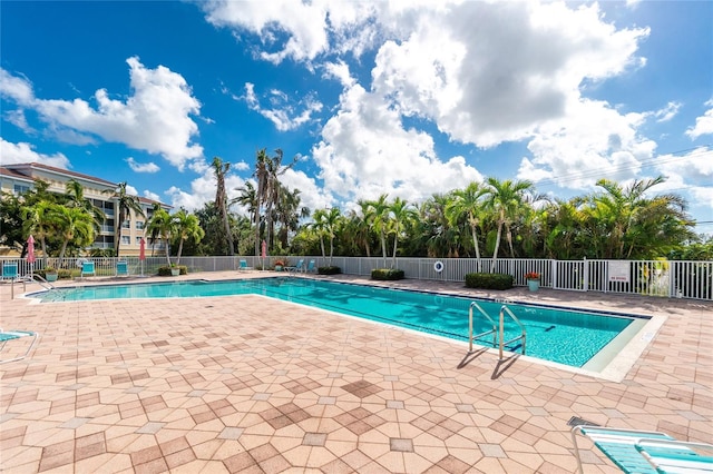 view of swimming pool with a patio area