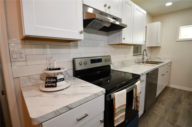 kitchen featuring white cabinets, backsplash, stainless steel appliances, sink, and dark hardwood / wood-style floors