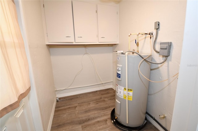 utility room featuring water heater