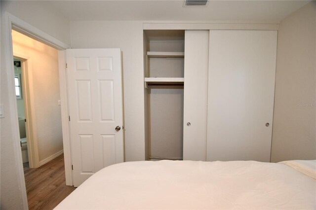 bedroom with wood-type flooring