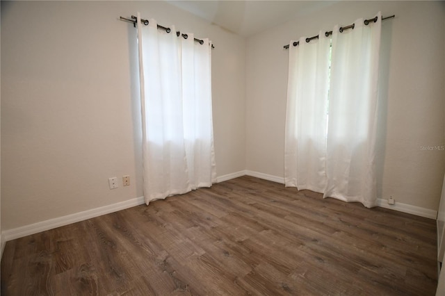 empty room featuring dark hardwood / wood-style floors