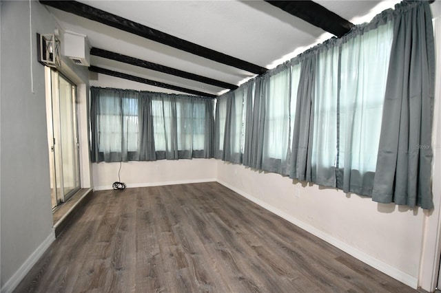 unfurnished room with lofted ceiling with beams and wood-type flooring